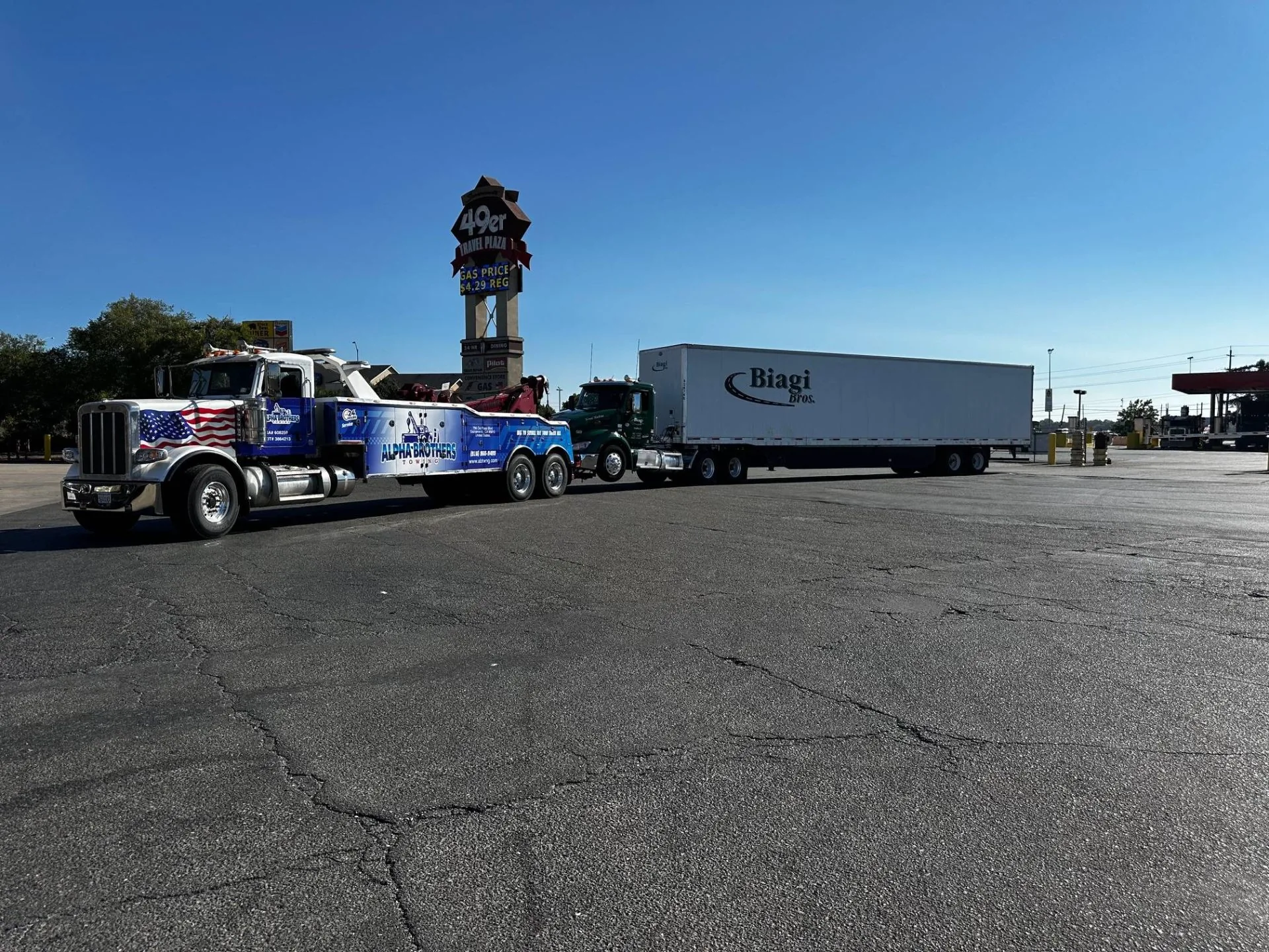 Alpha Brothers heavy wrecker towing a semi-truck in Sacramento